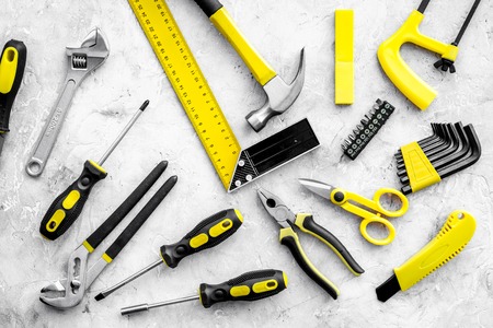 Various repair tools. Must-have for men. Equipment for building. Repair tool kit. Grey background...