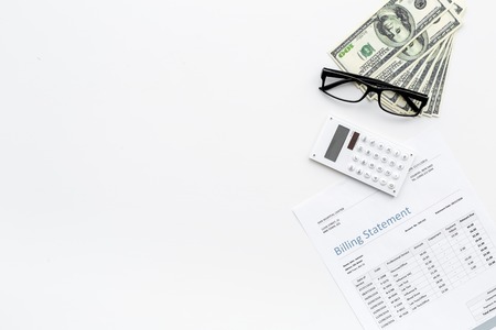 Pay bills and taxes. Billing statement, calculator, money on white background top view.の写真素材
