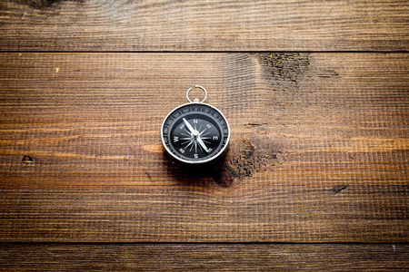 Compass on dark wooden background top view copy spaceの写真素材