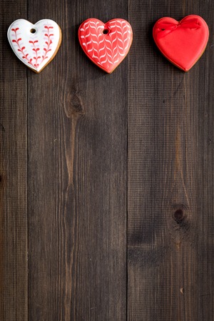 St Valentine's Day cookies in shape of heart on dark wooden background top view.の写真素材