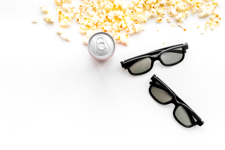 Cinema background. Snacks for film watching. Popcorn, glasses, drink on white background top view.の写真素材