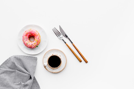Light sweet breakfast. Coffee and dessert on white table top view.の写真素材
