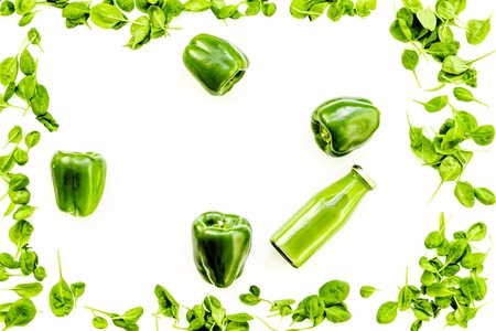 Green vegetables background with vegetable smoothies on white background top view.の写真素材