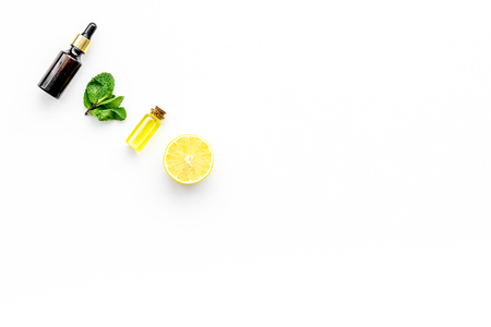 Skin care. Lemon oil, lemon lotion on white background top view copy spaceの写真素材