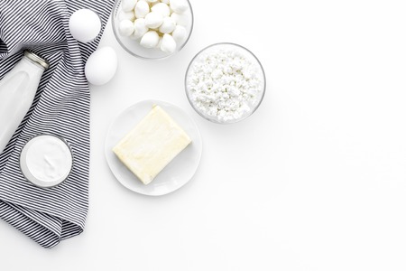 Fresh dairy products. Milk, cottage, cheese, yougurt on white table top view copy space. Monochromeの写真素材