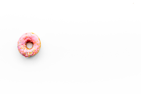 Unhealthy tasty sweets. Glazed donut on white background top view copy spaceの写真素材