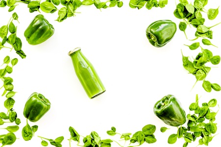 Green vegetables background with vegetable smoothies on white background top view.の写真素材