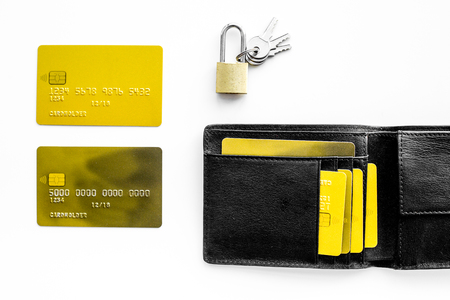 Protection of banking transactions. Bank cards near lock and keys on white background top view.の写真素材