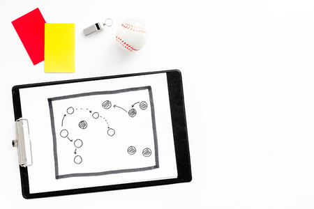Sport judging concept. Soccer referee. Tactic plan for game, ball, red and yellow cards, whistle on white background top view.の写真素材
