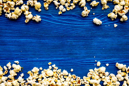 Popcorn background on blue top view copy space.の写真素材