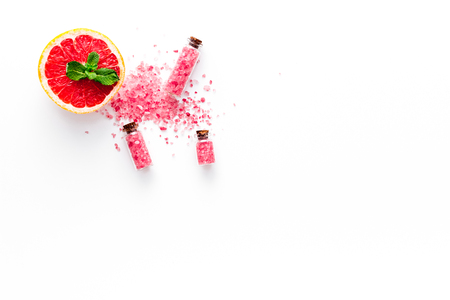 Natural citrus cosmetics. Spa salt near grapefruit on white background top view.の写真素材