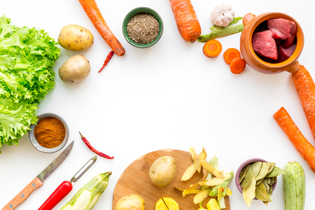 Ingredients for vegetable ragout cooking on white kitchen table background top view mock-upの写真素材