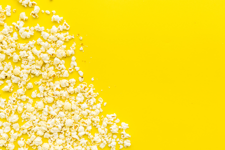Popcorn background on yellow top view copy space.の写真素材