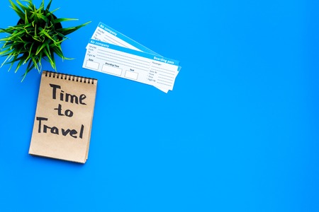 Sample of airplane ticket. Traveling with family and child. Time to travel on blue background top view mock upの写真素材