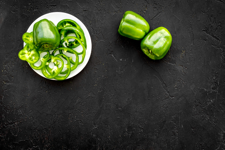 Vegetables for greeny smoothy with pepper on black background top view mock upの写真素材