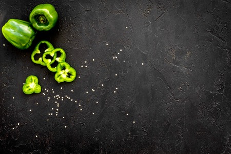 Greeny cocktail ingredients. Fitness smoothie. Pepper on black background top view space for textの写真素材