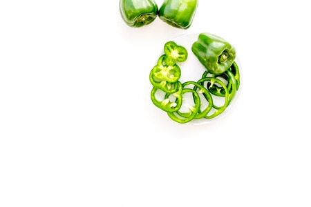 Greeny cocktail ingredients. Fitness smoothie. Pepper on white background top view space for text.の写真素材