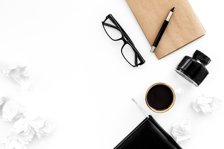 writer workplace with tools for work on white table background top view mockupの写真素材