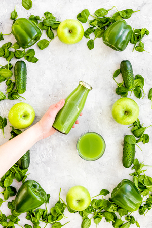 Cucumber, pepper, apple, celeriac. Vegetables for greeny organic smoothy for sport diet on stone background top view mockupの写真素材