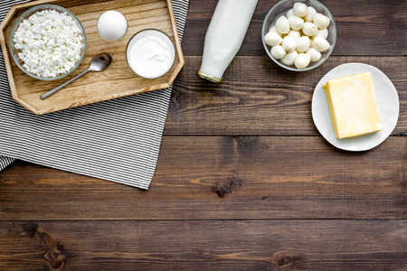 Dairy products from farm. Milk, cottage, cheese, yougurt on wooden top view mockupの写真素材