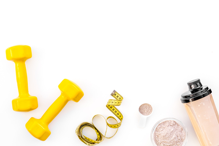 nutrition for workout with protein cocktail, powder and bars on white background top view mockupの写真素材