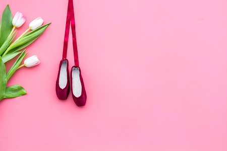 Professional dance shoes. Ballet concept. Pointes on pink background top view copy spaceの写真素材
