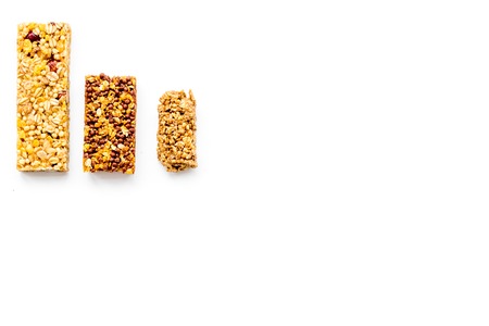 Granola bars for healthy nutritious breakfast. White background top view copy spaceの写真素材
