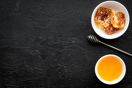 Fresh honeycomb ready to eat on black table top view copy spaceの写真素材