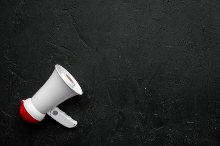 Megaphone make an announcement on black background top view copy spaceの写真素材