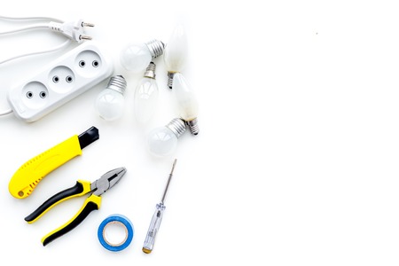 Electrical installation, wiring works. Tools and socket outlet on white background top view.の写真素材