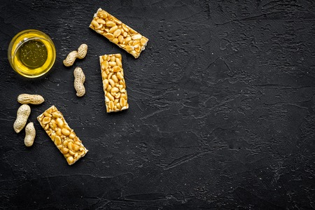 Energy protein snacks with peanuts on black background top view copy spaceの写真素材
