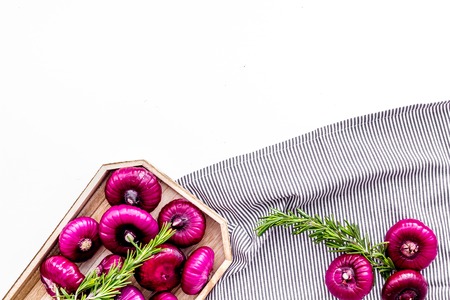 Red onion is healthy product. Onion bulbs in tray on white background top view space for textの写真素材