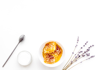 Honey as product for body, face and hair care. Cosmetics with honey. White background top view.の写真素材