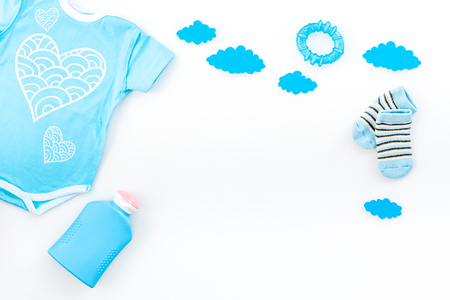 Newborn baby's sleep concept. To put the child to bed. Baby bodysuit near clouds on white background top view.の写真素材