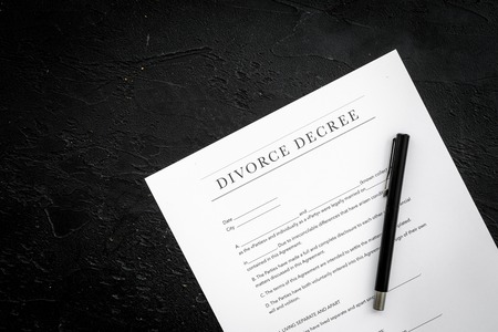 Divorce decree. Document on black background top view space for textの写真素材