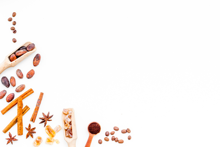 Ingredients for sweet bakery. Cinnamon, cocoa, sugar, coffee on white table top view copy spaceの写真素材