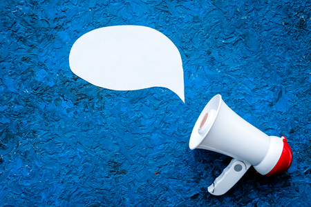 Statement concept. Megaphone near blank cloud for text on blue background top view copy space mockupの写真素材