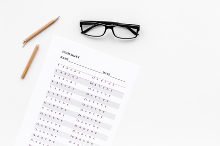 Exam sheet on white table flat lay space for text. Education conceptの写真素材
