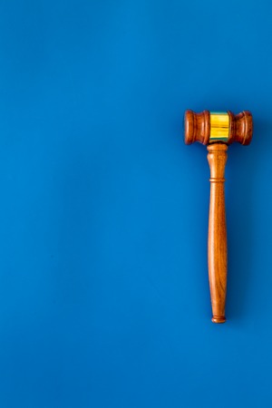 Law and court. Lawyer, attorney, judge concept. Judge gavel on blue background top view copy spaceの写真素材