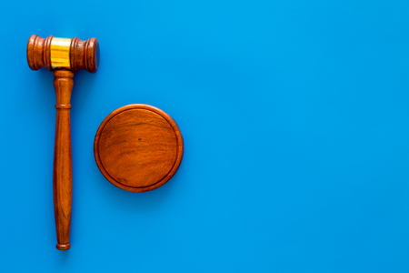 Law and court. Lawyer, attorney, judge concept. Judge gavel on blue background top view copy spaceの写真素材