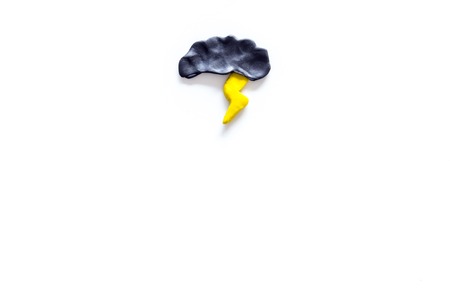 Storm weather concept. Air temperature. Cloud and lightening on white background top view copy spaceの写真素材