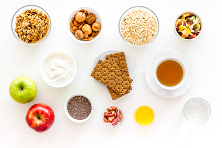 Ingredients for healthy breakfast on white background top view.の写真素材
