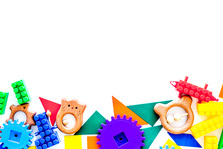 Educational toys for children mockup. Colorful plastic blocks and clacks on white background top view.の写真素材