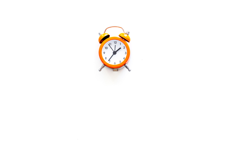 Alarm clock for for waking up on white background top view copy spaceの写真素材