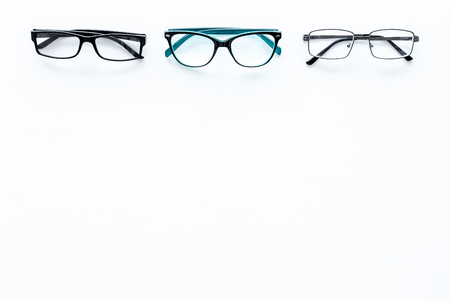 Glasses concept. Set of glasses with different eyeglass frame and transparent lenses on white background top view.の写真素材