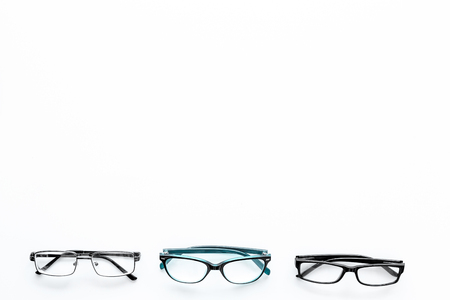 Glasses concept. Set of glasses with different eyeglass frame and transparent lenses on white background top view.の写真素材
