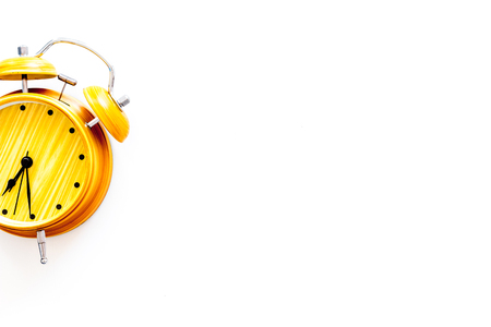 Alarm clock for for waking up on white background top view copy spaceの写真素材