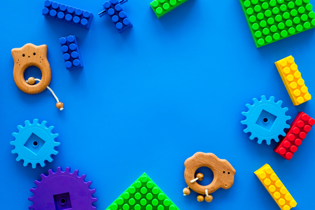Colored construction toys for children frame on blue background top view copy spaceの写真素材