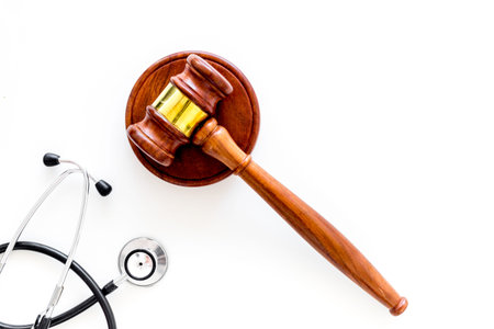 Medical law, health law concept. Gavel and stethoscope on white background top view copy spaceの写真素材