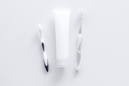 Clean teeth. Toothbrushes and tooth paste on white background top view.の写真素材